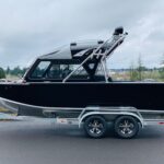 Boat with a custom rear-sweeping wakeboard tower