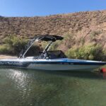 Boat with a custom forward-sweeping wakeboard tower