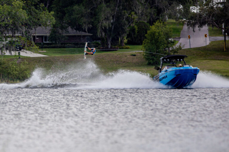 boat and wakeboarder on the lake at the Pro Wakeboard Tour Showdown at Lake David